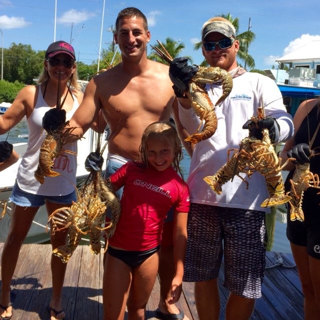 group-holding-lobsters-2 group-holding-lobsters-2